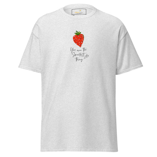 White t-shirt with strawberry graphic.